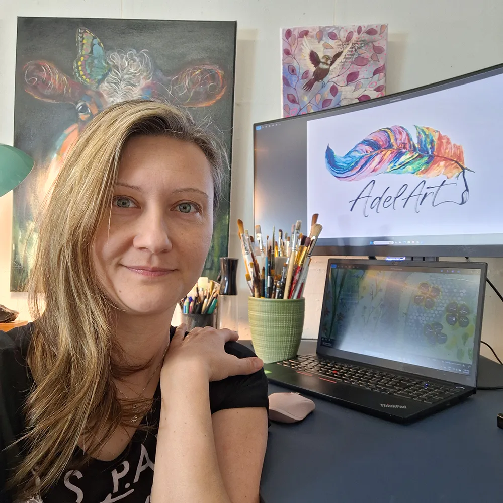 Adela in her art studio with neurographica artwork and digital tools