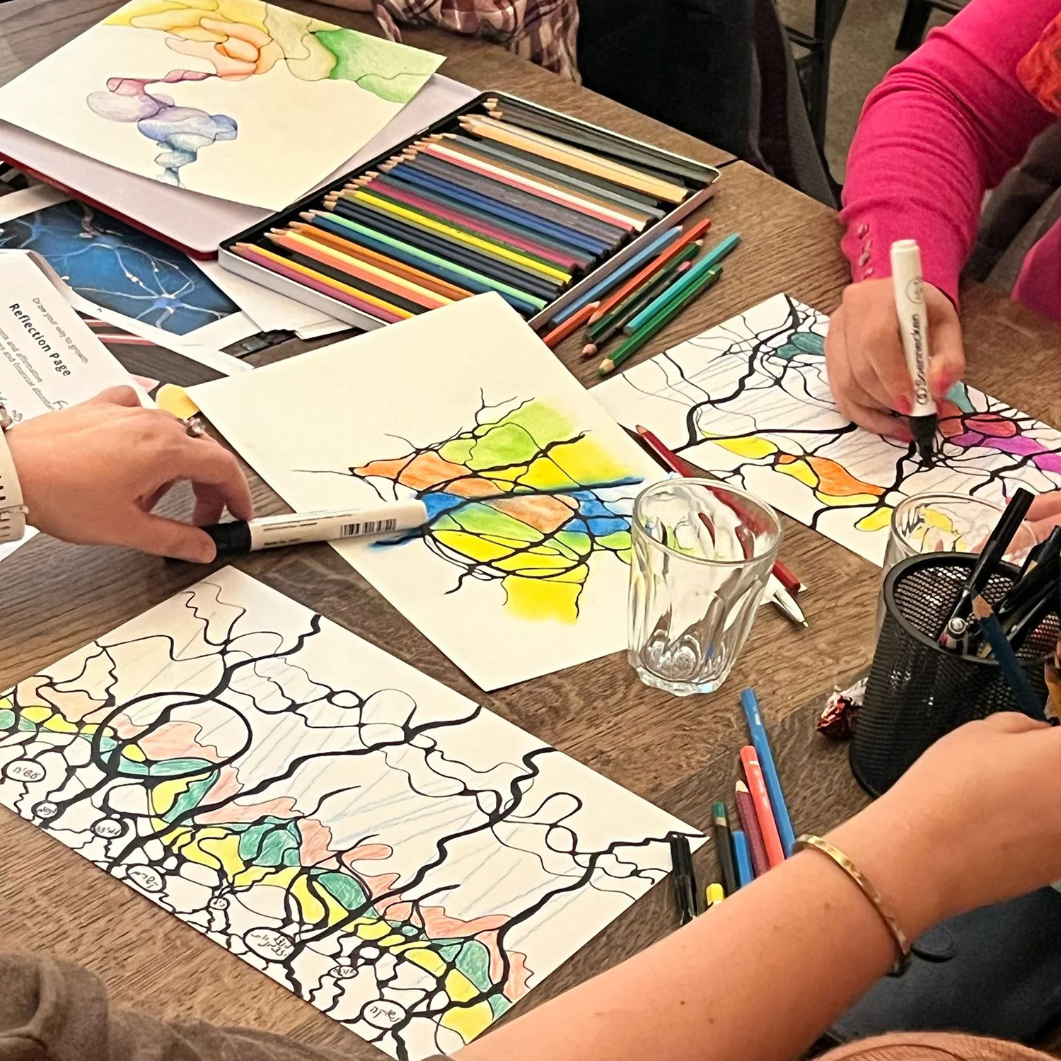 Participants adding colors to their neurographica drawings